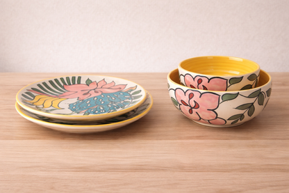 Tropical Petal Dining Collection - Set of 2: two woven rattan dining chairs with floral cushions.